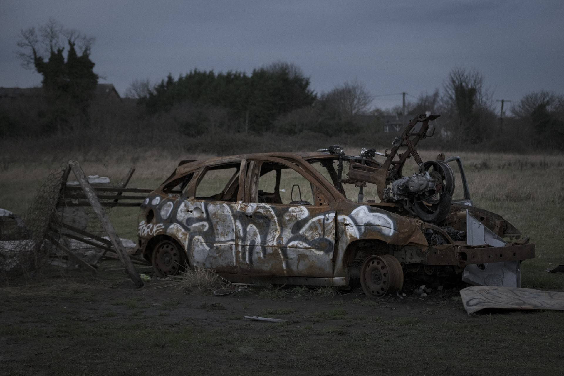 Abandoned car on a field