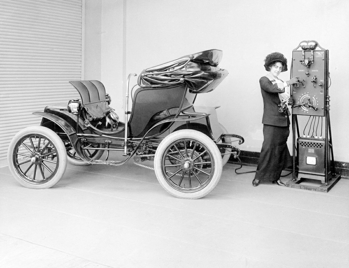 Vintage lady charging a car